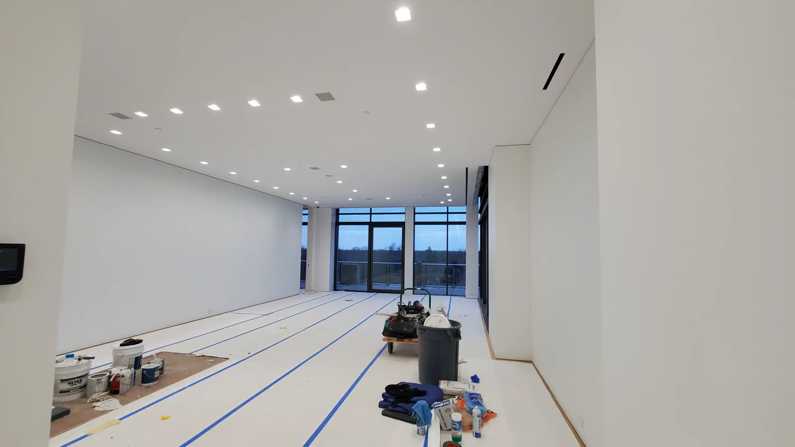 Fresh Interior Painting for Homes and Offices A clean, empty room with freshly painted white walls and ceiling, ready for occupancy in Michigan.