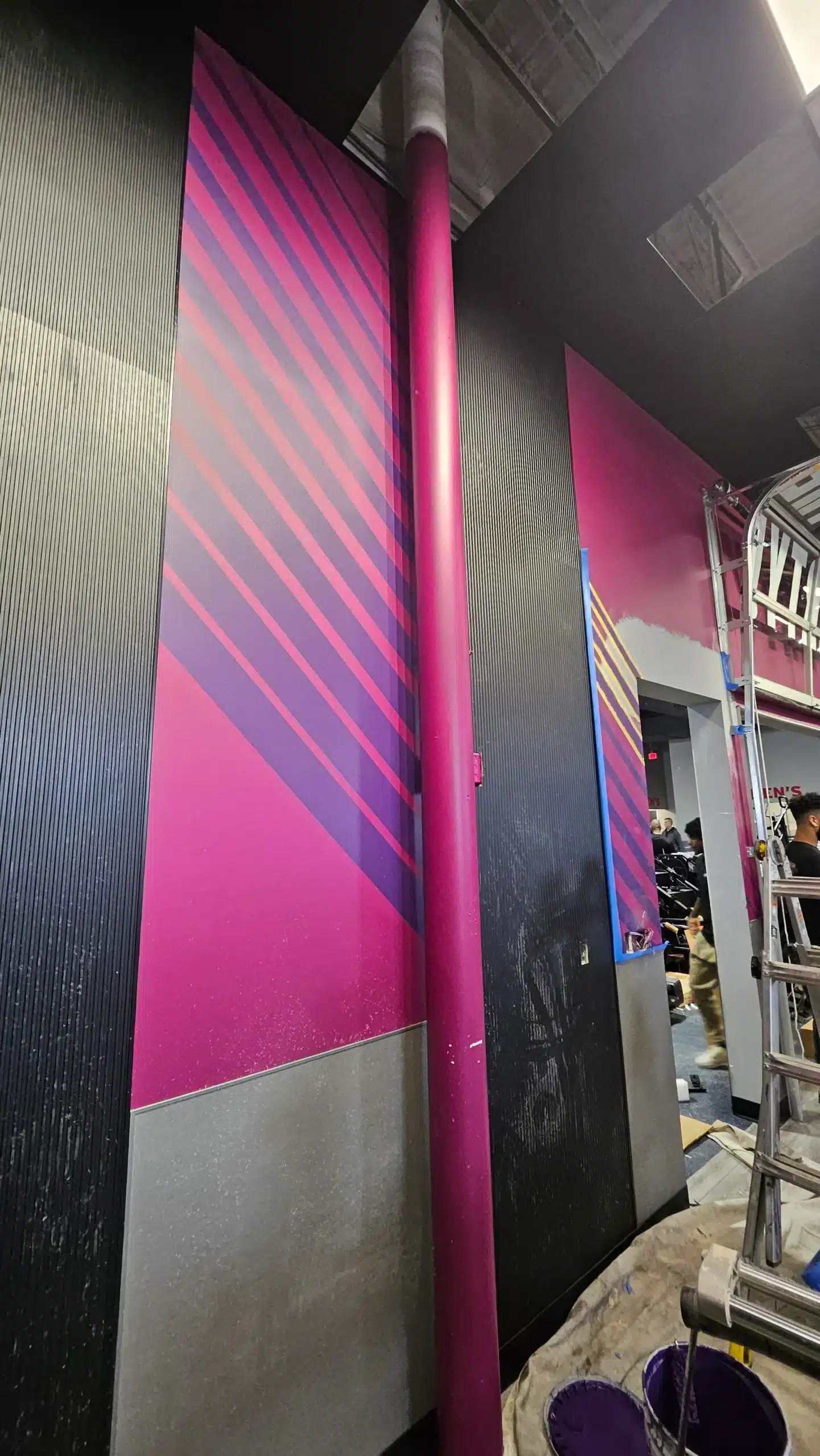 Vibrant Commercial Interior Accent Painting in Plymouth Michigan Striking pink and purple striped accent wall or pillar in a commercial interior space in Plymouth, Michigan.