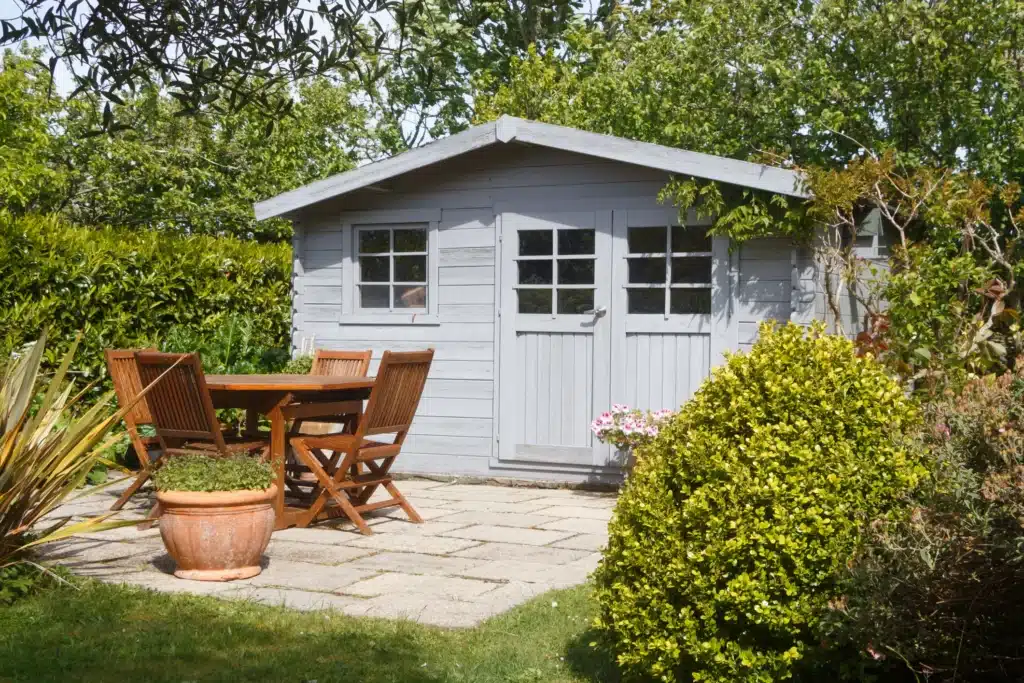 Residential Exterior Painting for Garden Sheds in Michigan Painted light gray exterior structure in Michigan