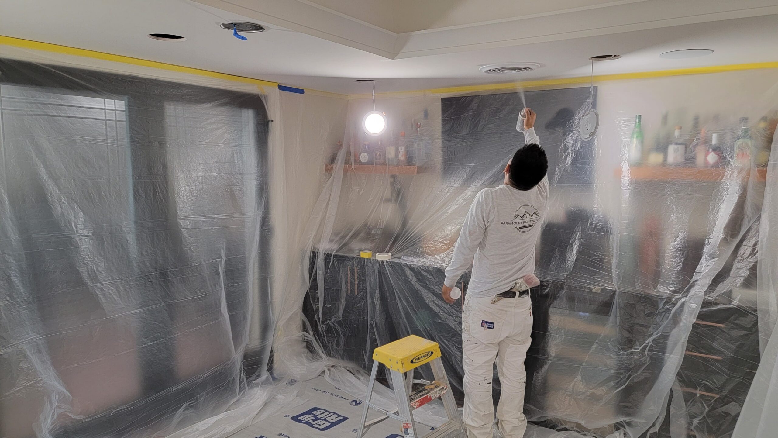 Interior Room Preparation Masking Deep blue accent walls with cream ceiling in a finished bedroom